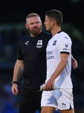 Plymouth boss Wayne Rooney with ex-Dons midfielder Jordan Houghton