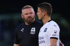 Plymouth boss Wayne Rooney with ex-Dons midfielder Jordan Houghton