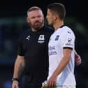Plymouth boss Wayne Rooney with ex-Dons midfielder Jordan Houghton