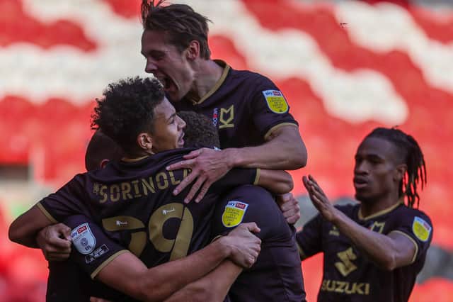 MK Dons celebrate Baily Cargill's late equaliser at Doncaster in 2020
