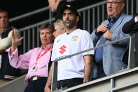 New owner Fahad Al Ghanim, wearing Dons' home shirt, was in the director's box for the game after taking over on Friday