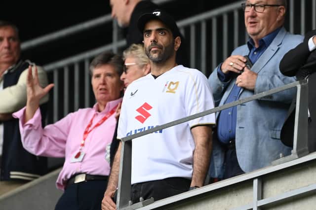 New owner Fahad Al Ghanim, wearing Dons' home shirt, was in the director's box for the game after taking over on Friday