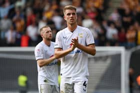 Jack Tucker believes Dons' defence is much stronger this term