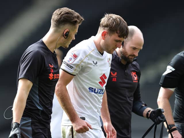 Laurence Maguire needed treatment before coming off against Walsall on Saturday