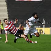 It was a story of two red cards at Stadium MK on Saturday as MK Dons and Doncaster Rovers shared a 1-1 draw