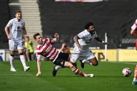 It was a story of two red cards at Stadium MK on Saturday as MK Dons and Doncaster Rovers shared a 1-1 draw