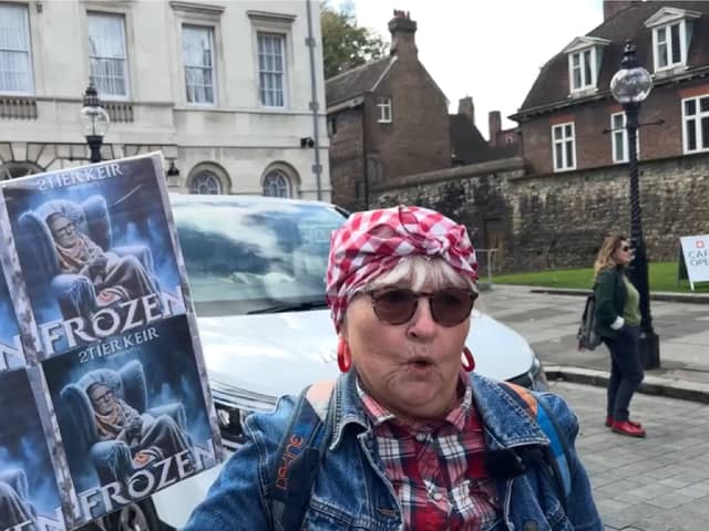 Protester speaks at winter fuel cuts rally.