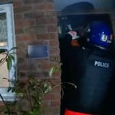 Body worn footage shows officers before a raid on a suspected gangster's home in West Midlands. 