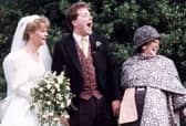 Alex and Sue Tatham on their wedding day with Cilla Black.