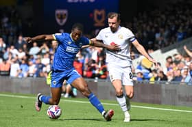 Alex Gilbey battles for the ball at Plough Lane