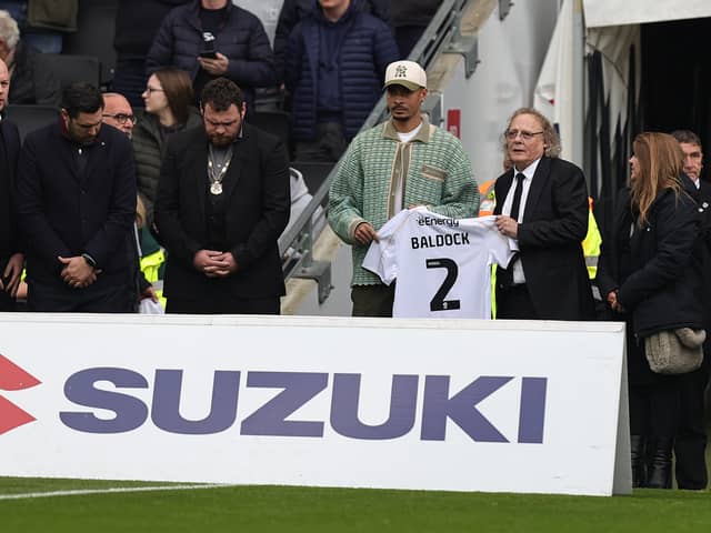 Dele Alli and Pete Winkelman paid tribute to George Baldock at Stadium MK two weeks ago