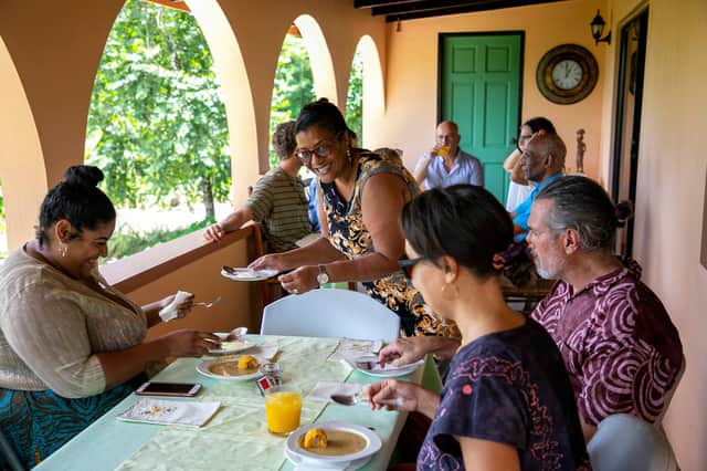 Chef Kennedy and family welcome visitors in their own home in Grenada to cook home grown produce