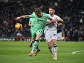 Scott Hogan battles for the ball against Cheltenham