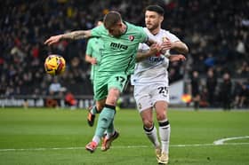 Scott Hogan battles for the ball against Cheltenham