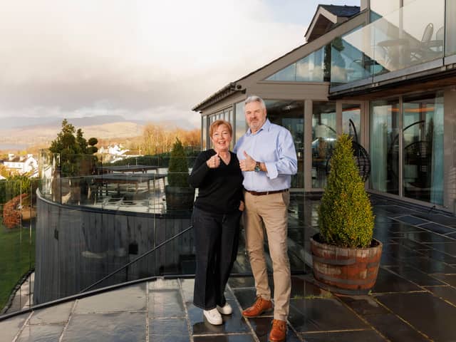 Omaze winners Catherine & Chris Carwardine at their £3 million mansion in Lake Windermere. 