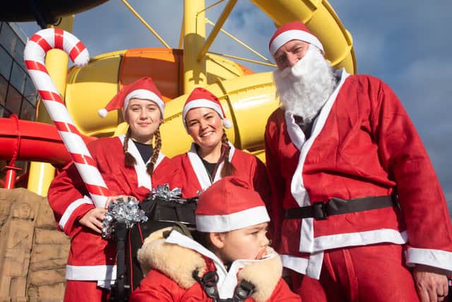 The Gregson family run the Santa dash. Mabel Gregson (bottom) has Battens Disease and is the face of this years' fundraiser for Trinity Hospice.