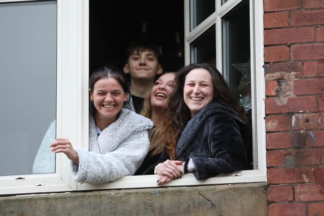 Residents await evacuation by the emergency services after the flood which hit their building Meadow Mill on Water street in Stockport. January 1 2025.