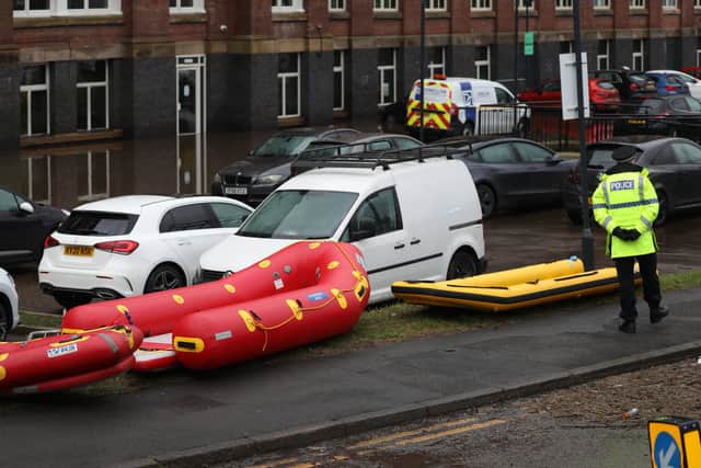 Car are flooded outside a newly converted Meadow Mill on Water street in Stockport as emergency teams arrive to rescue people trapped inside. January 1 2025.