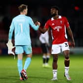 Tom McGill and Salford's Hakeeb Adelakun when the sides met earlier this season