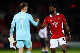 Tom McGill and Salford's Hakeeb Adelakun when the sides met earlier this season
