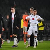 MK Dons players looking disappointed after losing to Notts County on Boxing Day