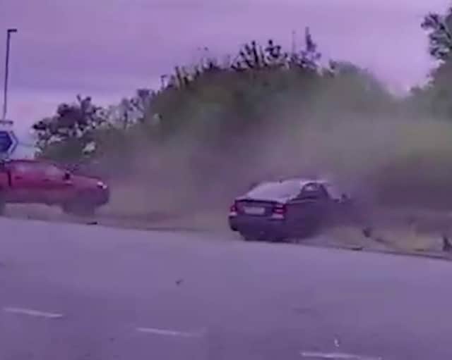 Maredudd Francis crashes his grey BMW 325 into another driver.
