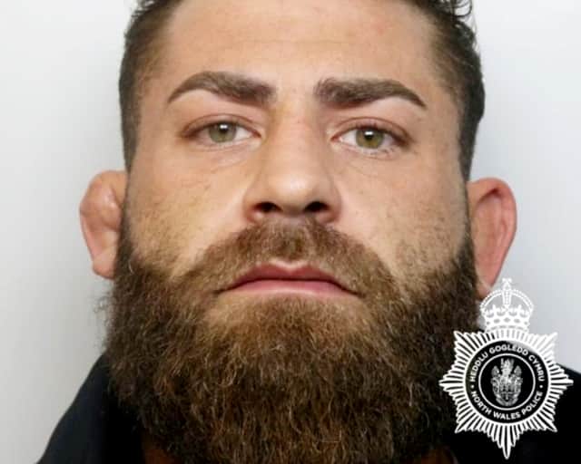 Maredudd Francis crashes his grey BMW 325 into another driver.