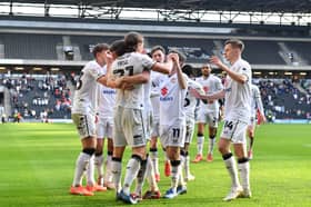 MK Dons celebrate Danilo Orsi's winner against Morecambe