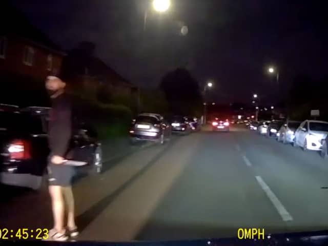 Murder victim drives away from his killer who is still grasping knife.