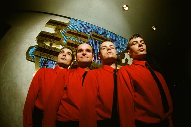 Kraftwerk in front of world time clock in Keio Plaza Hotel, Tokyo, September 1981.