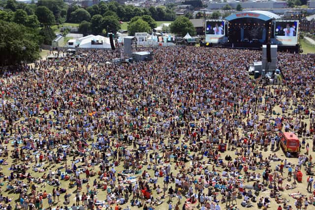 Music fans enjoy the fine weather at the Isle of Wight Festival on June 14, 2009 in Newport, Isle of Wight. The festival, attended by 50,000 music fans, which features headline acts The Prodigy , Stereophonics and Neil Young, is in its eighth year after being reincarnated in 2002.
