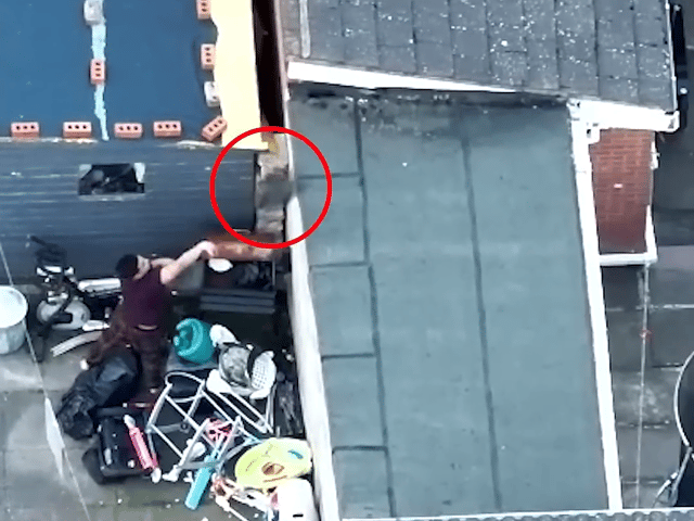 Drug dealer lobs bin bag of heroin over fence during police raid