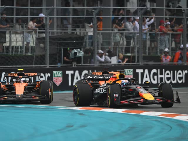 Max Verstappen fought vehemently to keep the McLarens behind him early on