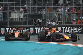 Max Verstappen fought vehemently to keep the McLarens behind him early on