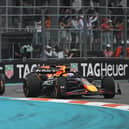 Max Verstappen fought vehemently to keep the McLarens behind him early on