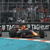 Max Verstappen fought vehemently to keep the McLarens behind him early on