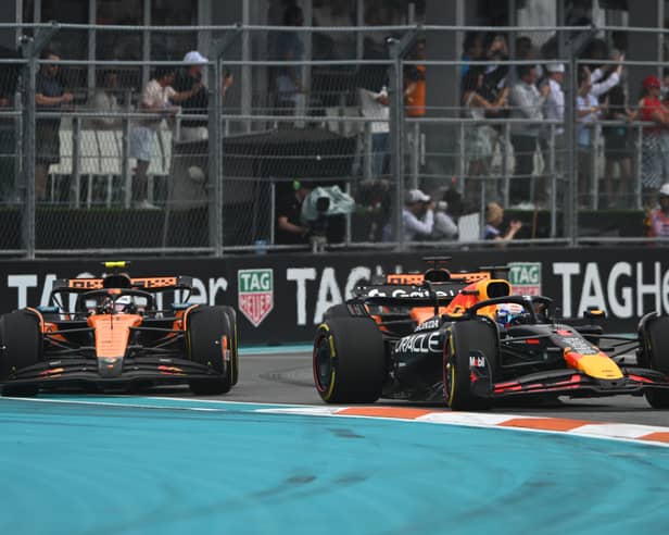 Max Verstappen fought vehemently to keep the McLarens behind him early on