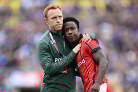 Walsall's Liam Gordon is consoled by Danny Johnson after their play-off final defeat