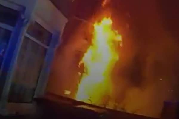 Dramatic moment massive house fire rages as police race to evacuate street.