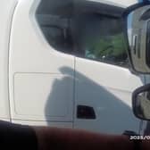 Lorry driver caught rolling cigarette with no hands on wheel
