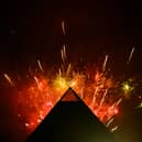 Fireworks explode in the sky above the Pyramid Stage at Glastonbury Festival