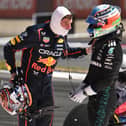Max Verstappen speaks with Kimi Antonelli after their first lap crash