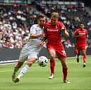 MK Dons and Oldham locked horns on the opening day of the season