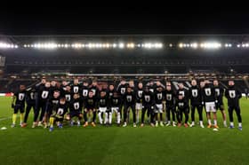 Players from MK Dons and Oxford United pose in their George Baldock Foundation shirts ahead of the FA Cup third round 