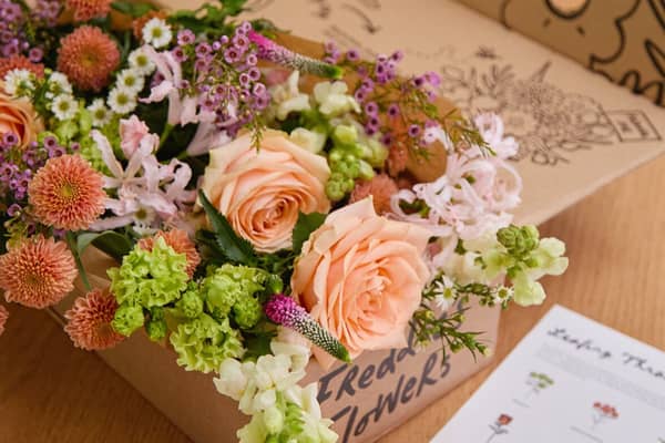 The blooms are carefully wrapped and boxed for delivery.