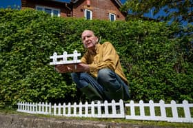 Kevin Pringle with his stinger fence at his home in Milton Keynes.