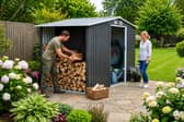 The spacious metal garden shed combines secure tool storage with a dedicated section for keeping logs dry and organised
