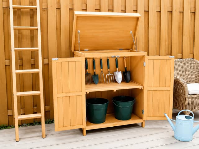 The compact wooden potting shed is designed to maximise storage space without taking over the garden