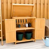 The compact wooden potting shed is designed to maximise storage space without taking over the garden
