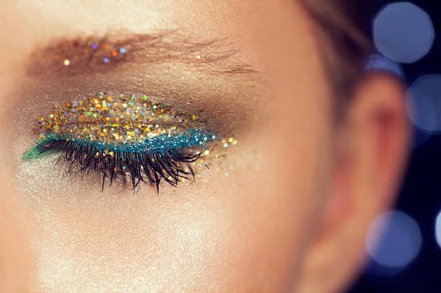 Glitter primers, sparkling eyeshadows and shimmering lip glosses are among this year's festival beauty essentials. Photo posed by model.